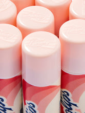 Close-up shot of the Lanolips Basic Balm Strawberry tube. The tubes made from 100% post-consumer-recycled material. 