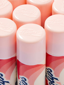 Close-up shot of the Lanolips Basic Balm Strawberry tube. The tubes made from 100% post-consumer-recycled material. 