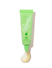 Lanolips 101 Ointment Multi-Balm Green Apple in a fresh green squeezable tube with a white cap. The packaging features the Lanolips logo in crisp white lettering and a small apple icon, highlighting its fruity, nourishing formula. A dollop of the rich, glossy balm is visible at the opening, showcasing its ultra-hydrating texture. Infused with lanolin and green apple extract, this balm provides deep moisture and a refreshing scent, perfect for soothing dry lips and skin.
