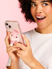 Model holding the Lanolips Lip Balm Phone Holder