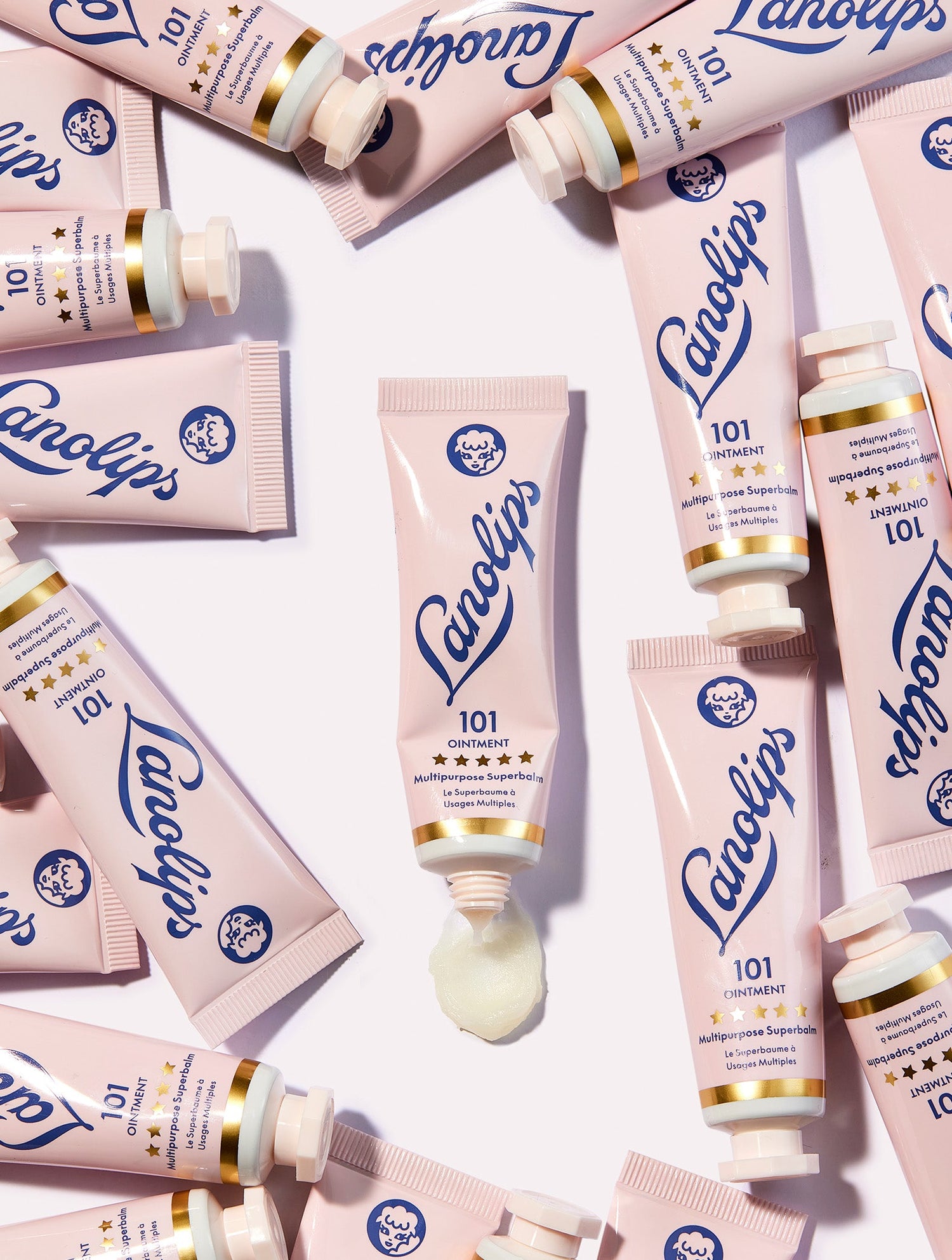 Product image of the 101 ointment multipurpose superbalm tube surrounded by many tubes of the same product.