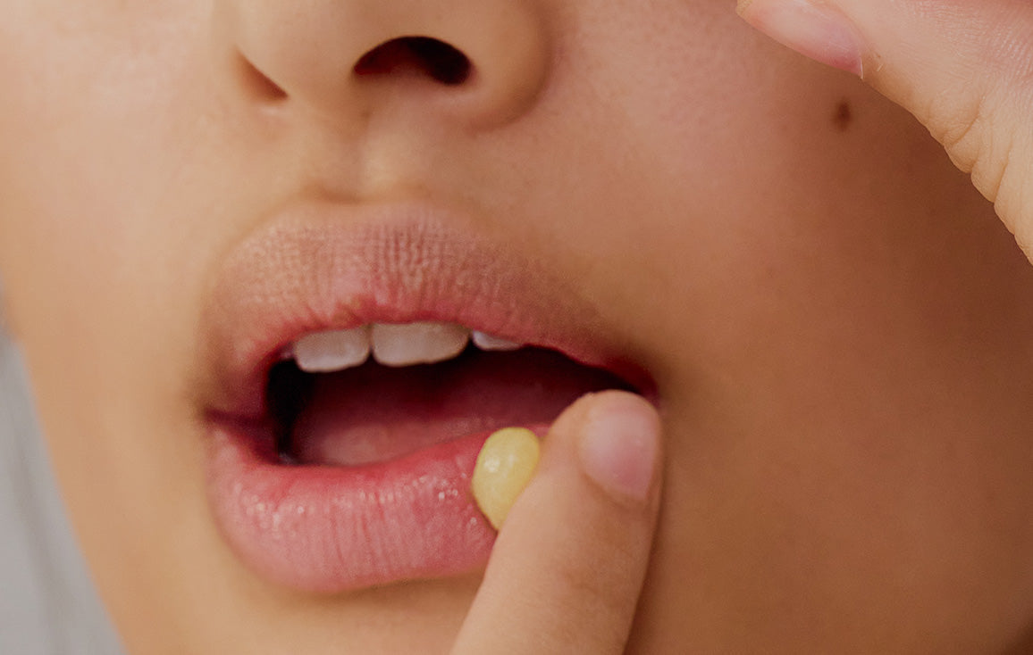 Close up of lips before applying Lanolips 12 Hour Overnight Lip Mask. A small dab of lanolin-rich balm with hyaluronic acid, vitamin C, and ceramides targets dry, chapped lips for deep overnight hydration and repair.