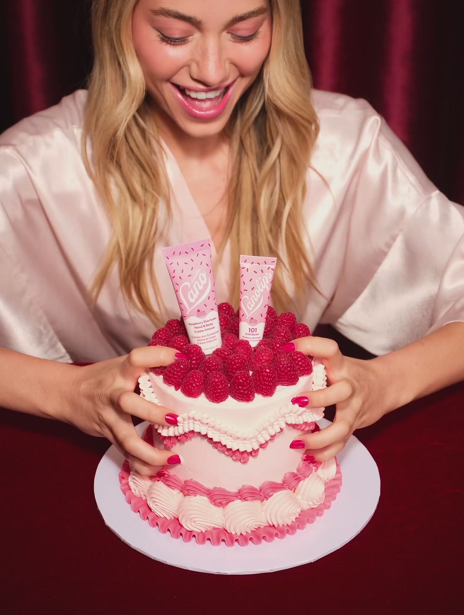 Video of model eating the raspberry shortcake with her hands. The Lanolips 101 Ointment Multi-Balm Raspberry Shortcake and the Raspberry Shortcake Hand & Body Cream are featured in the limited edition Lanolips Raspberry Shortcake Holiday Duo. 