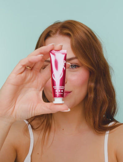 A video of a model applying and wearing Lanolips Baby Rose Gold 101 Ointment, revealing a dewy pink-flushed tint with soft rose gold pigments. The ultra-hydrating formula melts into the lips and cheeks, mimicking a natural, healthy flush. The lightweight, non-sticky balm enhances moisture while adding a luminous glow.