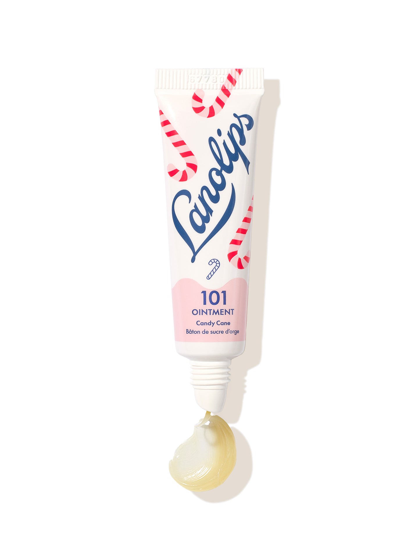 A squeezed tube of Lanolips 101 Ointment Multi-Balm Candy Cane lip balm on a white background.
