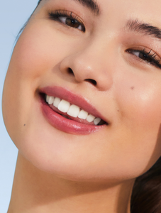 Model with Rhubarb Tinted Balm in Rhubarb is the perfect your-lips-but-better tint.