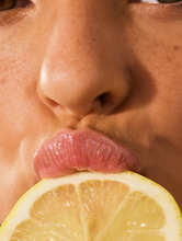 Close up shot of model wearing the Lemonaid Lip Treatment